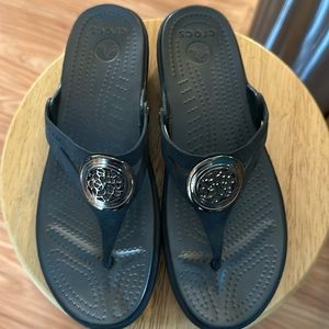 Croca sandals.   Like new!   Black and bronze ornamental design